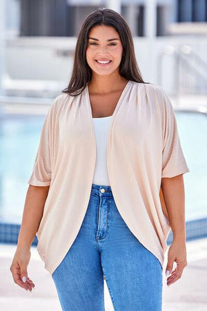 a woman standing in front of a swimming pool