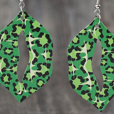a pair of green and black leopard print earrings