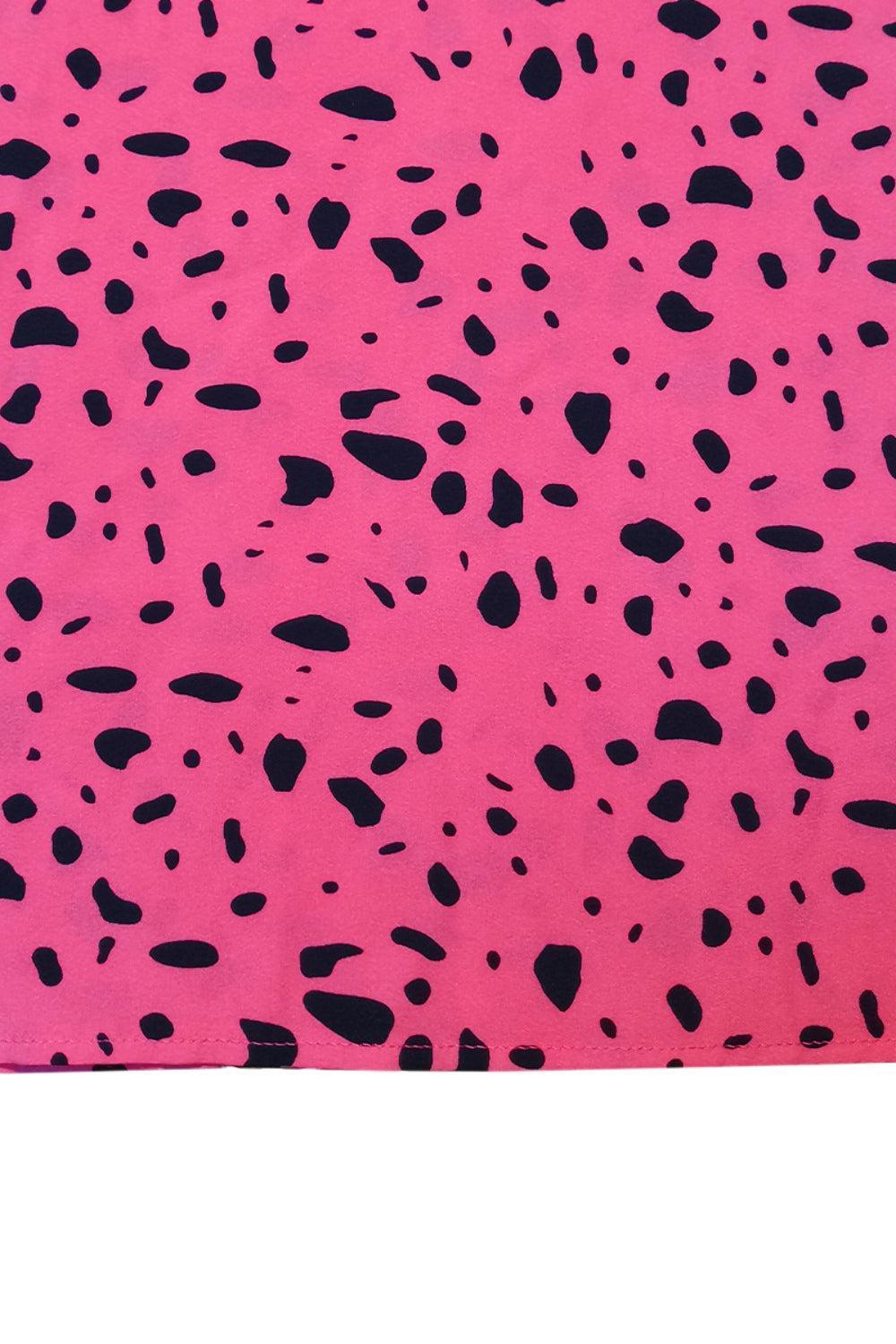 a pink and black animal print rug on a white background
