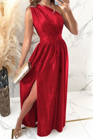 a woman in a red dress taking a selfie