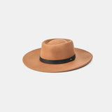 a tan hat with a black band on a white background