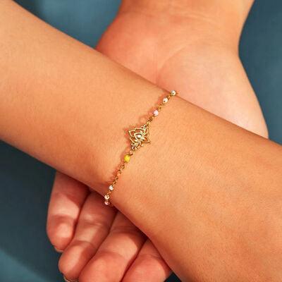 a woman's arm with a bracelet on it