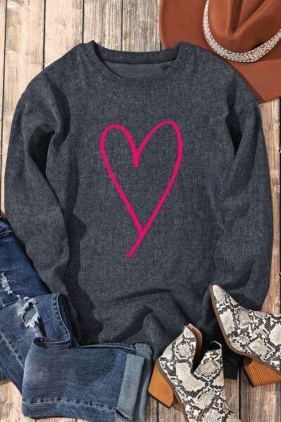 a sweater with a heart drawn on it