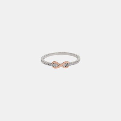 a white and rose gold ring with diamonds