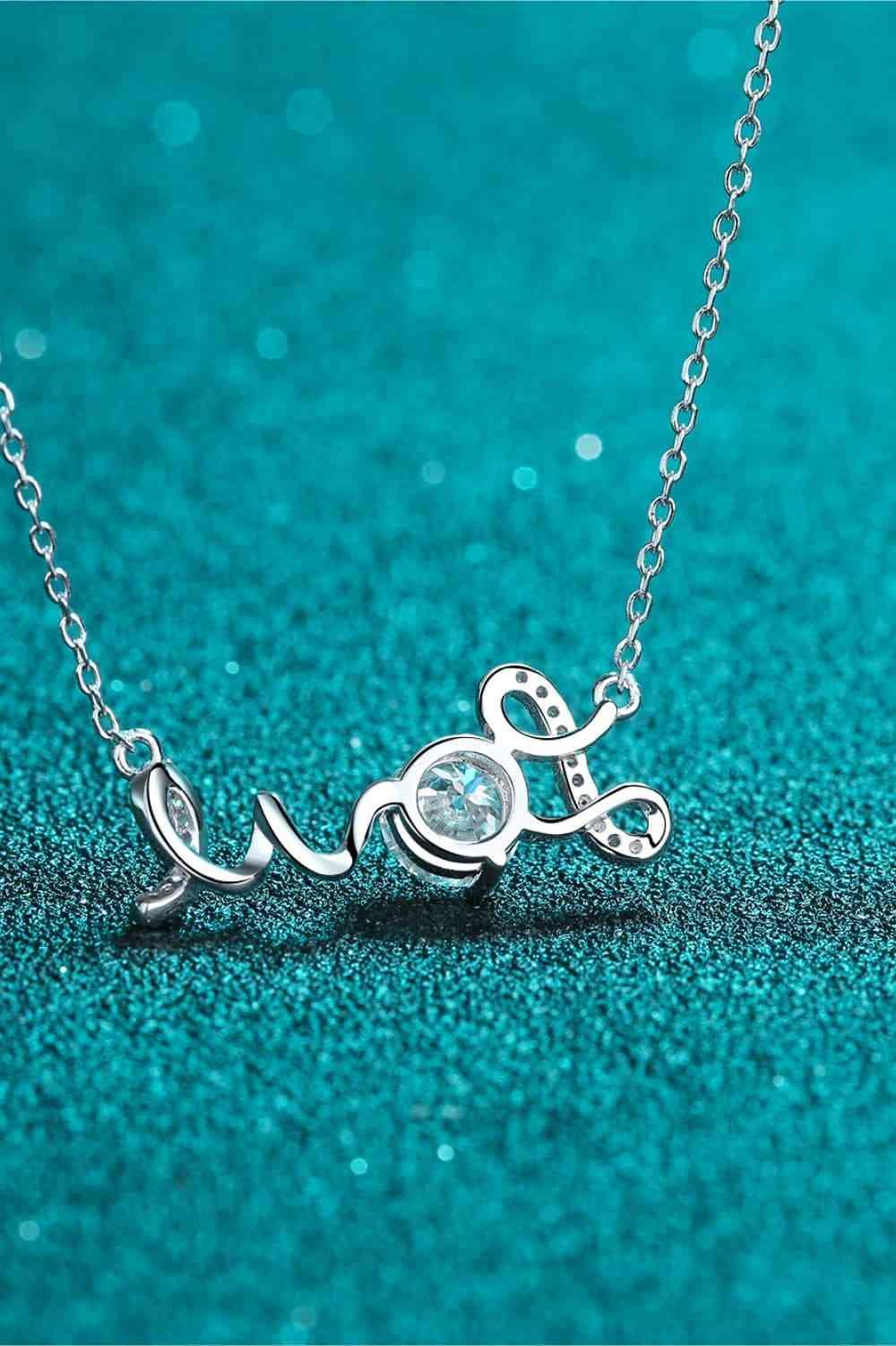 a necklace with the word love written on it