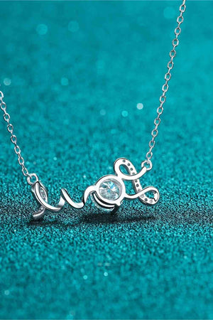 a necklace with the word love written on it