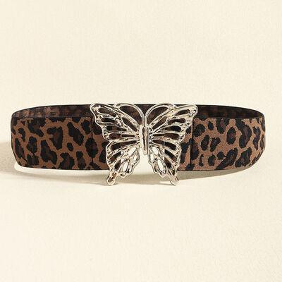 a leopard print belt with a butterfly buckle