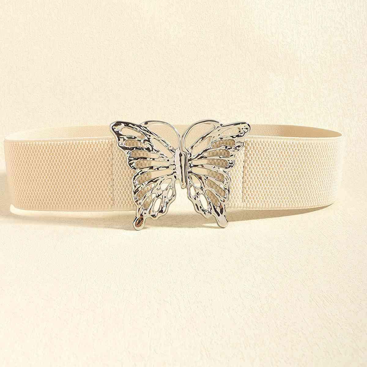 a white belt with a butterfly buckle on it