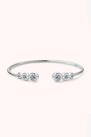 a silver bracelet with three stones on it