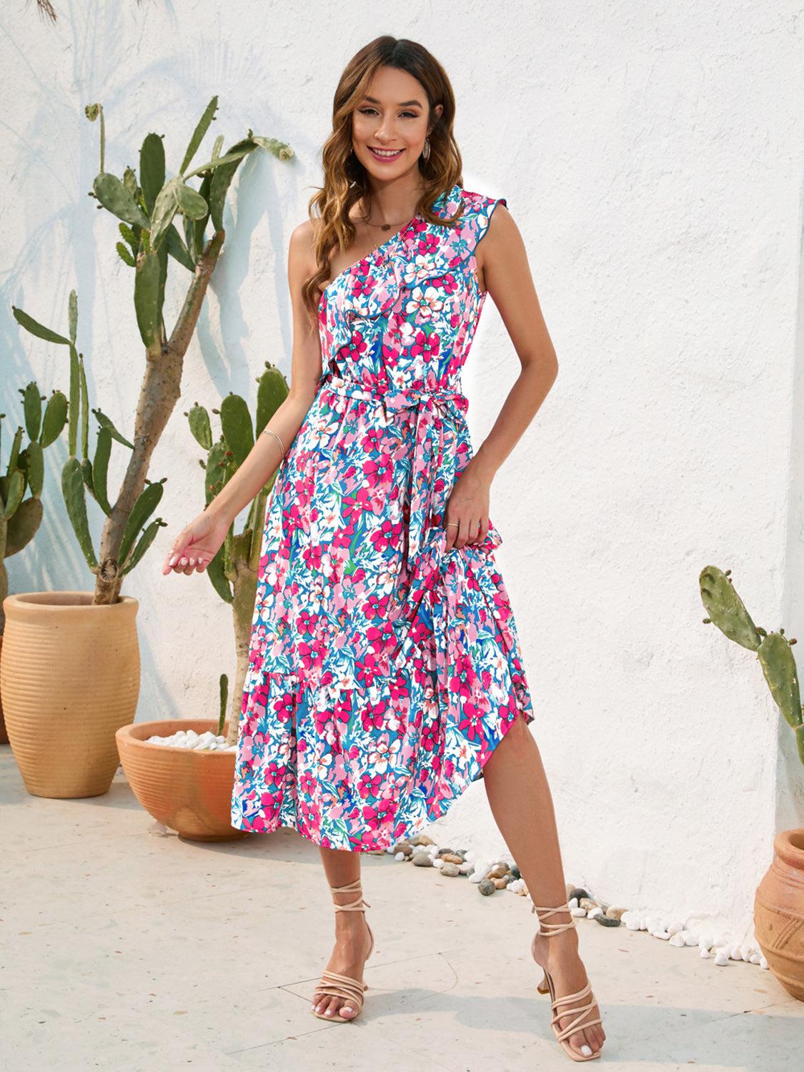 a woman standing in front of a potted plant