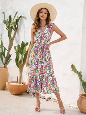 a woman wearing a hat standing in front of a cactus