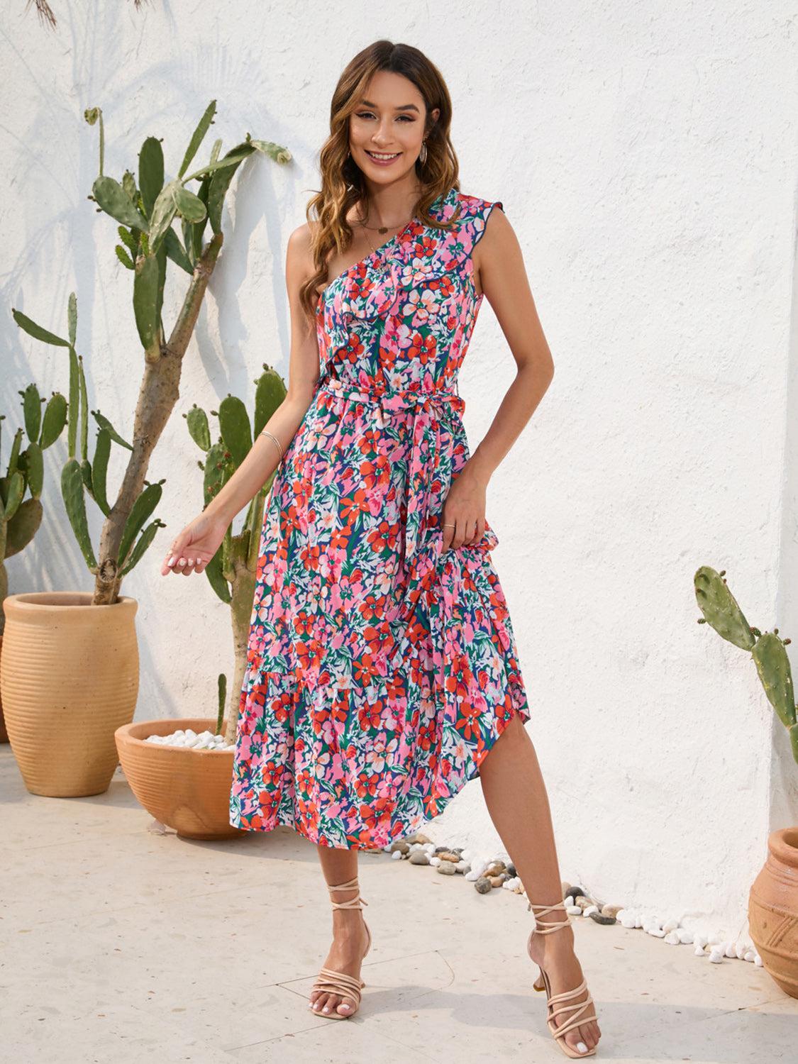 a woman standing in front of a potted plant