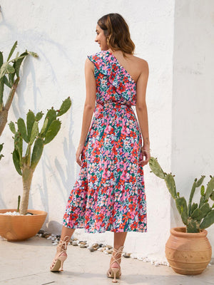 a woman standing in front of a potted plant