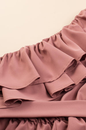 a close up of a pink dress with ruffles