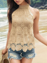 a beautiful young woman standing on top of a sandy beach