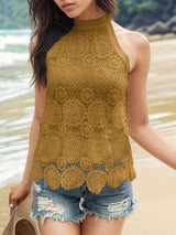 a beautiful young woman standing on top of a sandy beach