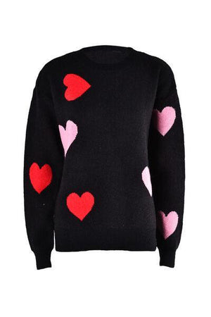 a black sweater with pink and red hearts on it