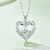 a heart shaped necklace with a diamond center