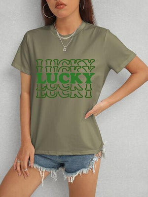a woman wearing a t - shirt that says lucky