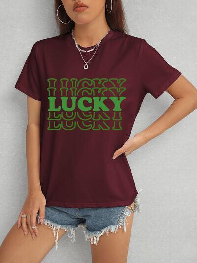 a woman wearing a t - shirt that says lucky