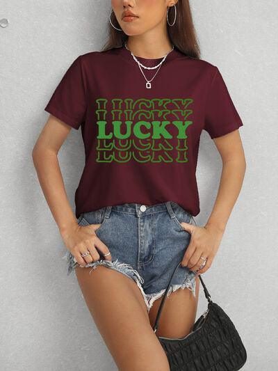 a woman wearing a burgundy lucky lucky lucky t - shirt