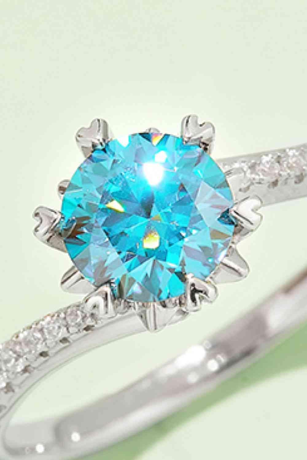 a ring with a blue topaz surrounded by white diamonds