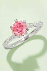 a ring with a pink diamond in the center