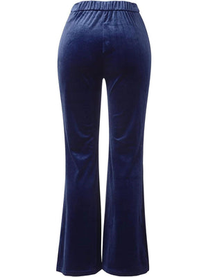 a woman wearing a blue velvet pants