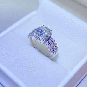 a diamond engagement ring in a white box