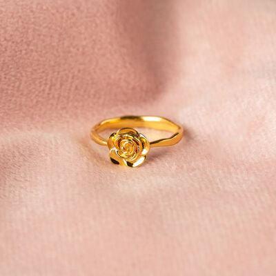 a gold ring with a rose on it