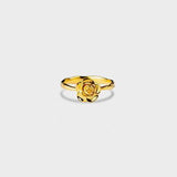 a gold ring with a rose on it