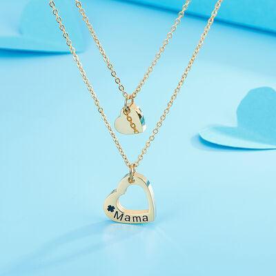 a necklace with a heart and a name on it