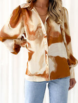 a woman wearing a brown and white shirt