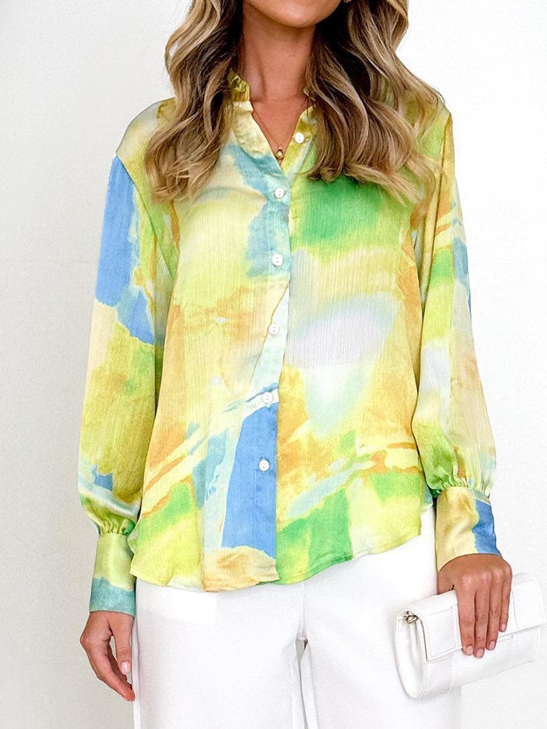 a woman is wearing a colorful shirt and white pants