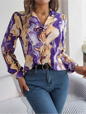 a woman wearing a purple shirt and jeans