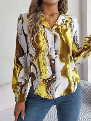 a woman wearing a yellow and white shirt