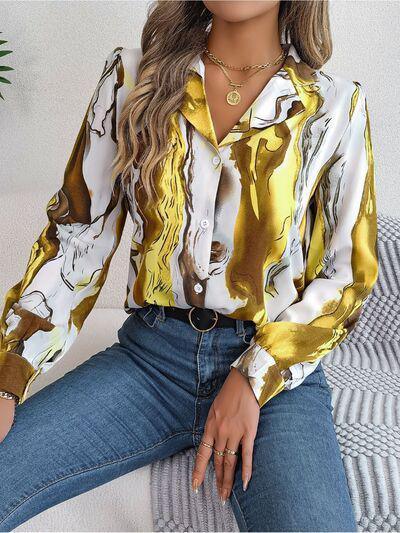 a woman sitting on a couch wearing a gold and white shirt