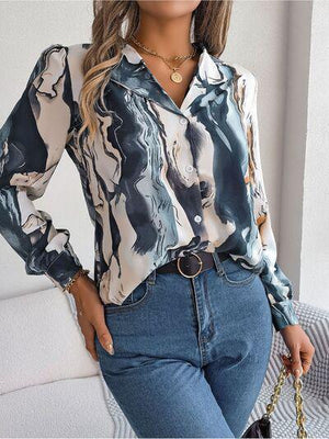 a woman wearing a blouse and jeans