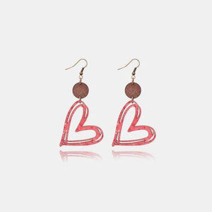 a pair of earrings with the letter b on it