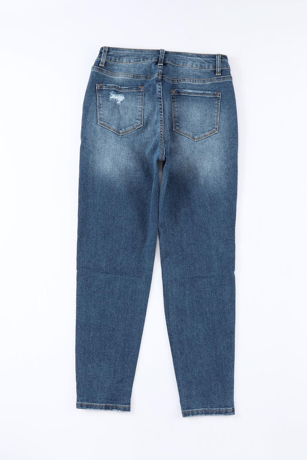 a pair of blue jeans on a white background