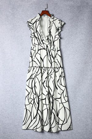 a white and black dress hanging on a hanger