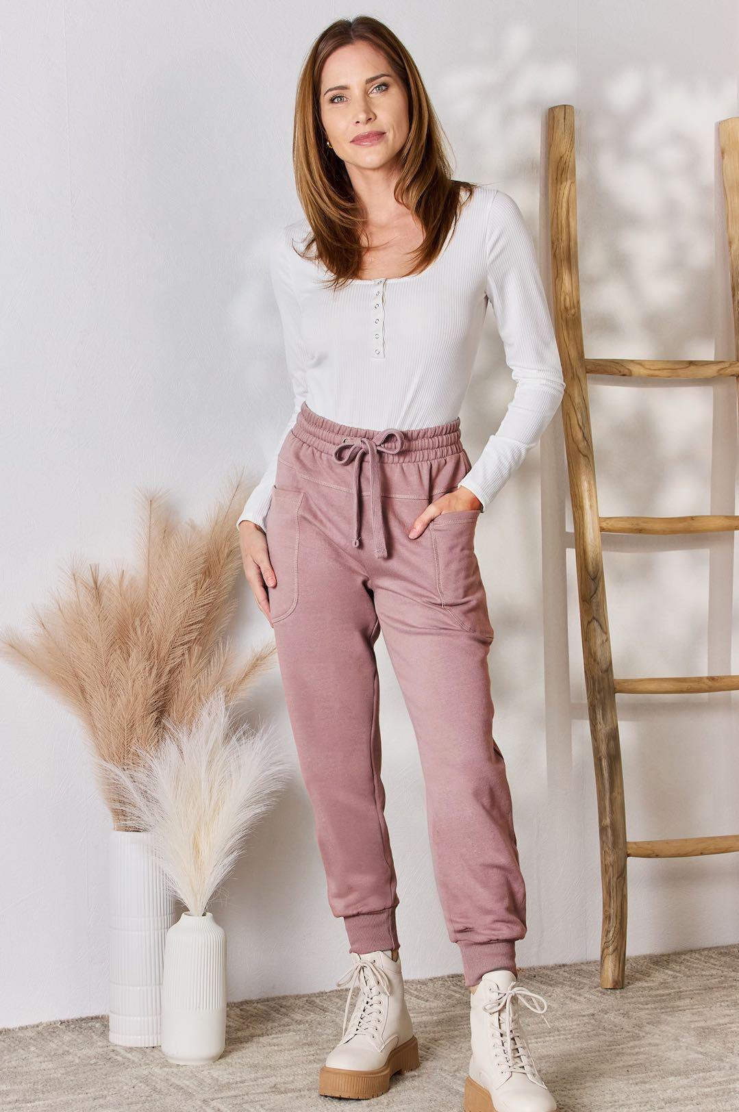 a woman standing in front of a ladder