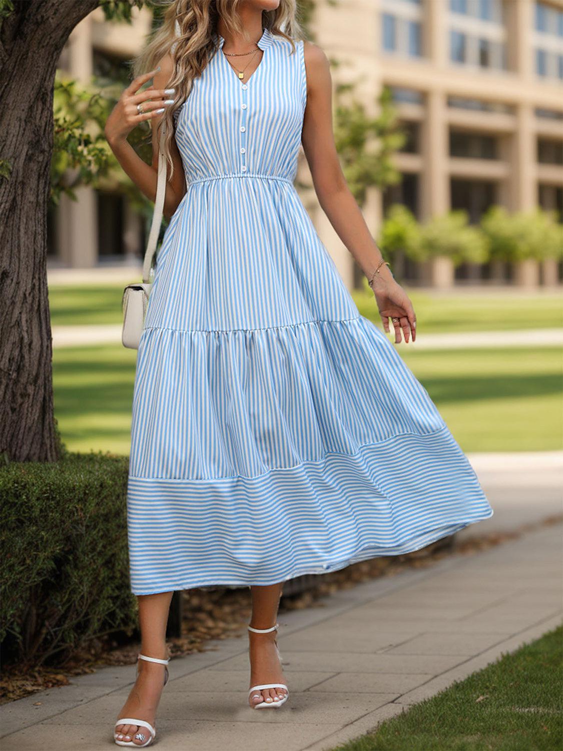 a woman in a blue and white striped dress