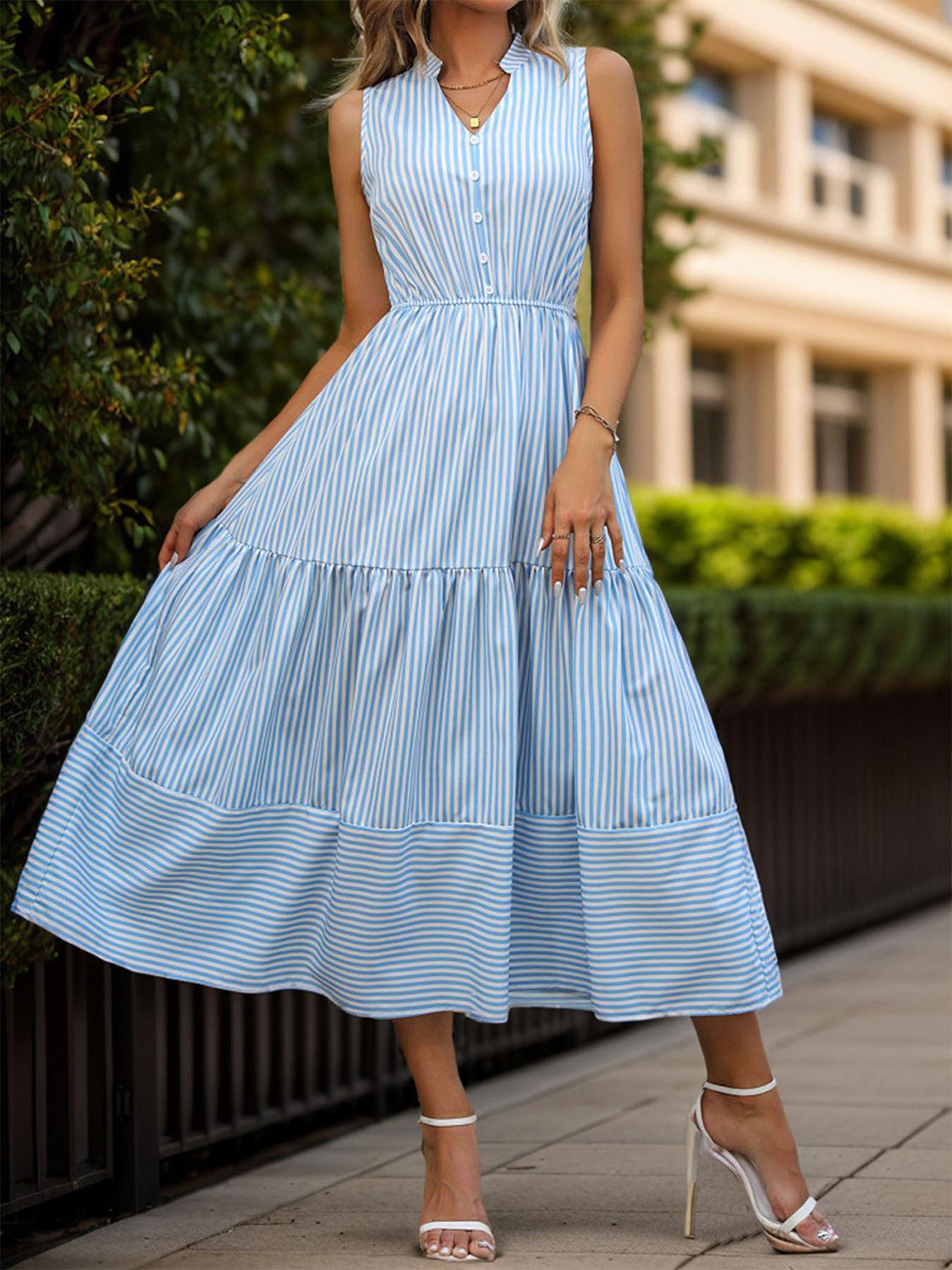 a woman wearing a blue and white striped dress