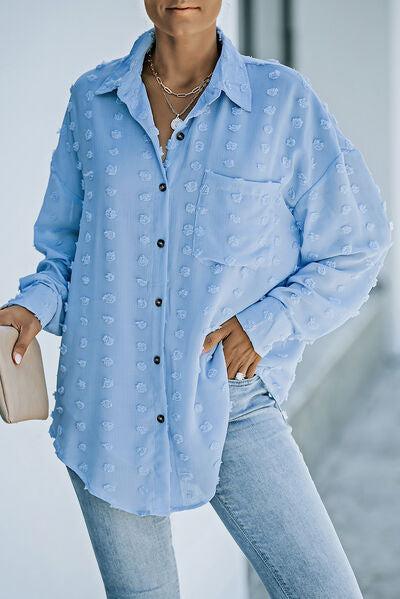 a woman wearing a blue shirt and jeans