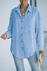 a woman wearing a blue shirt and jeans