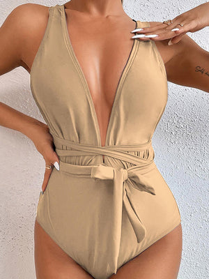 a woman in a tan one piece swimsuit