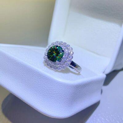 a ring with a green center surrounded by white diamonds