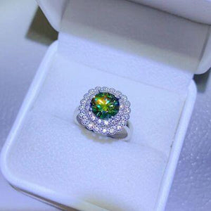 a ring with a green center surrounded by white diamonds