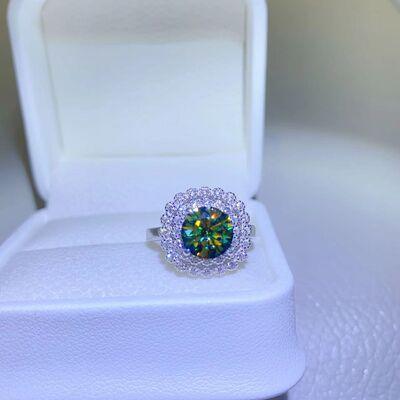a ring with a green center surrounded by white diamonds